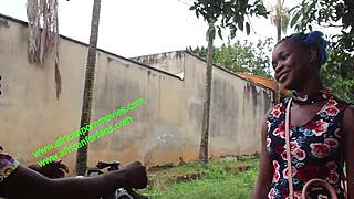 The motorcycle taxi driver shares a private moment with his client in the village undergrowth.