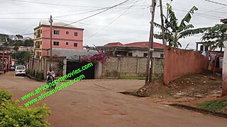 The motorcycle taxi driver shares a private moment with his client in the village undergrowth.