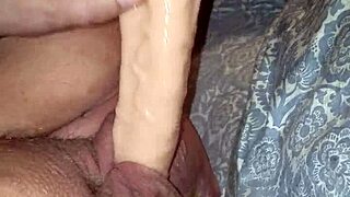 A submissive woman is spanked hard in a BDSM lezdom session with bondage and choking.