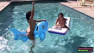 Teen lesbians finger each other at the pool party! 😍