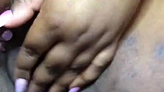 ebony woman masturbates with fingers and squirts