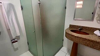 shared bathroom in the dorm, redhead with natural tits giving a handjob