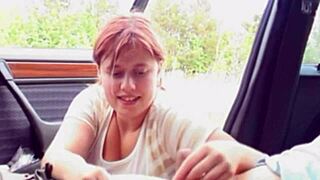Young redhead BBW explores wild fun in a car.