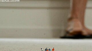 A beach goddess crushes with her giant dirty soles.