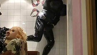 In this retro blue film, Roxina interacts with her turbo doll in a toilet setting, captured in XXL WMV format for detailed viewing.
