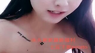 I watch this Asian amateur girl perform a strip show.