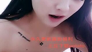 I watch this Asian amateur girl perform a strip show.