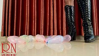 High heels boots pop small balloons in femdom domination close up