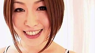 Watch this Asian hottie tease the camera with her cock sucking skills