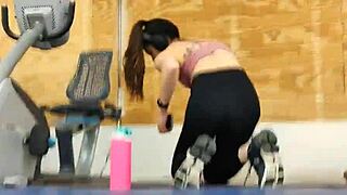 Asian Woman In Black Leggings At Gym