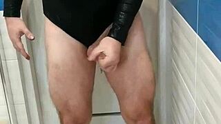 this tranny in sexy leotard and shiny skirt looks hot 😍