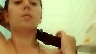 brunette bathing in the shower