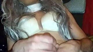 Horny transsexual shemale plays with her hard cock in solo scene, teasing and stroking slowly on bed alone