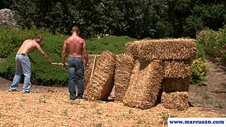 ripped jock masturbates alongside farmhand in outdoor setting! 💪