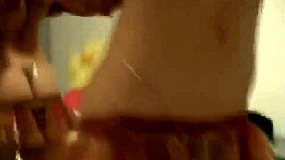 A woman performs a striptease dance, revealing her body