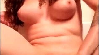 A performer on webcam engages in an intense solo activity with a toy, showcasing crossdressing and transsexual elements in a detailed session.