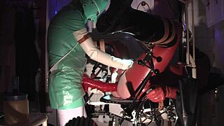 Rubbernurse Agnes in jade green latex pegs her patient to the limit with a long dildo.