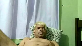 Young gay boy engages in intense sex with his partner on the bed.