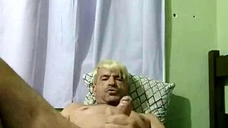 Young gay boy engages in intense sex with his partner on the bed.