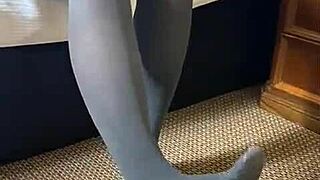 Erika teases in sexy stockings, garter belt, and lingerie, showing off her great ass