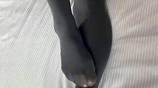 Erika teases in sexy stockings, garter belt, and lingerie, showing off her great ass