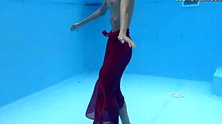 Tiny skinny Hungarian pornstar Hermione Ganger swims in the pool. Her petite brunette frame glides underwater with friends nearby.