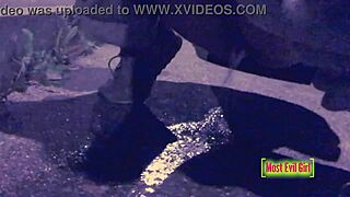girl alone at night in parking lot lowers pants to piss