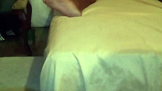 Solo guy strokes big black cock on bed