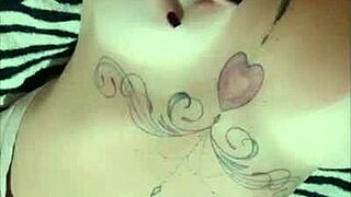 Tattooed beauty shows off her tan lines for the web