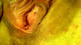 Petite European amateur with pendulant tits masturbates and gives interracial handjob