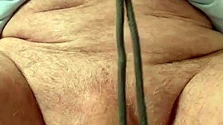 Mature gay man ties his cock and balls. The bdsm session builds intense pleasure.