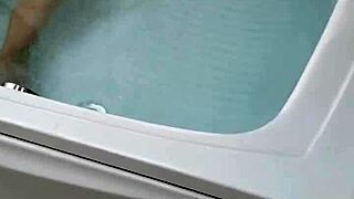 sexy pornstar enjoys masturbation in hydro massage bathtub focusing on boobs and cock details