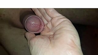 The blonde milf wife collects cum after licking and swallowing in homemade handjob.