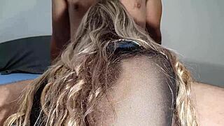 Is this cute girl riding a big cock while sucking it provocatively?