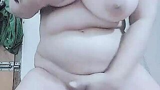 horny layla plays with big tits while fingering pussy in group scene.