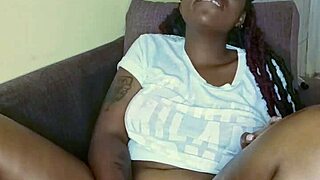 Look at this black babe teasing her pussy with big tits
