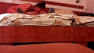 Middle-aged woman gives a sloppy blowjob in a hotel room
