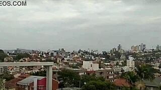 Feeling The Passion On The Balcony With Big Tits Exposed In Intense Moments.