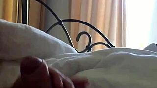 A mature woman gives an early morning handjob.