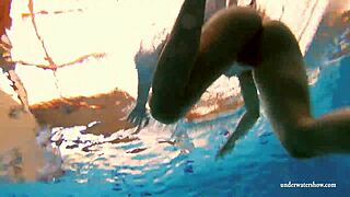 Kristy, a stunning brunette, flaunts her curves in the pool