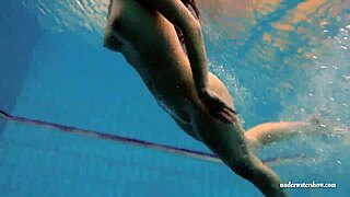 Kristy, a stunning brunette, flaunts her curves in the pool