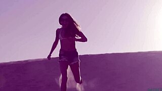 Petite and beautiful talia mint relaxes on the public beach