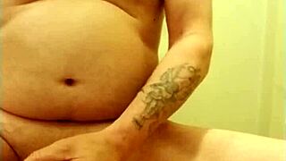 man practices self-pleasure with a ring on his member