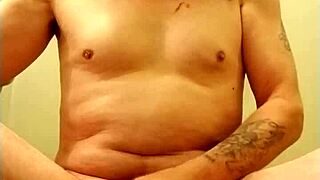 man practices self-pleasure with a ring on his member