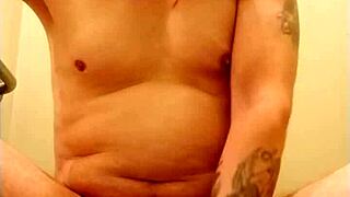 man practices self-pleasure with a ring on his member