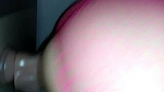 Playing with dildo and sucking on toy.