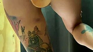 an unknown tattooed teen girl was recorded in a women's clothing store with a butt plug.