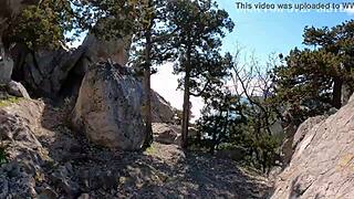 Wow, check this girl's stunning ass by the sea and mountains!