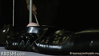 In this bondage scene, the submissive is bound and experiences sadomasochistic pleasures with intense sensations.