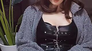 beautiful japanese ladyboy in cat ears strokes cock while crossdressing.